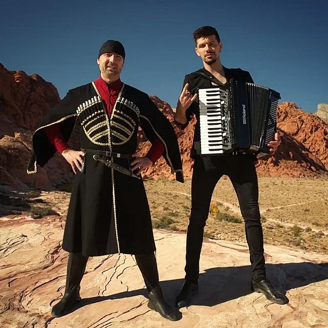 Aleksei Chebeliuk performing outdoors with accordion