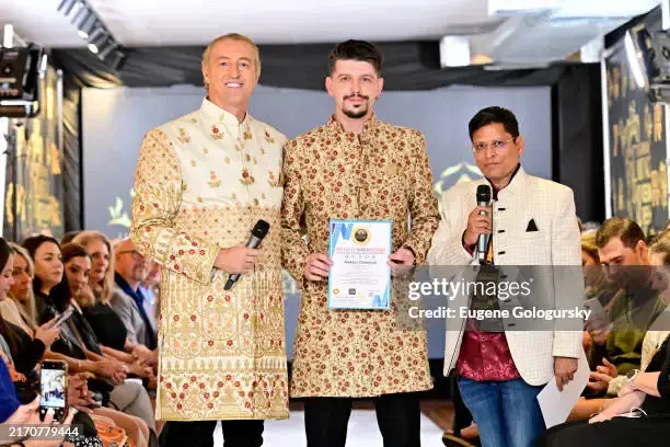 Aleksei Chebeliuk receiving recognition at a cultural event