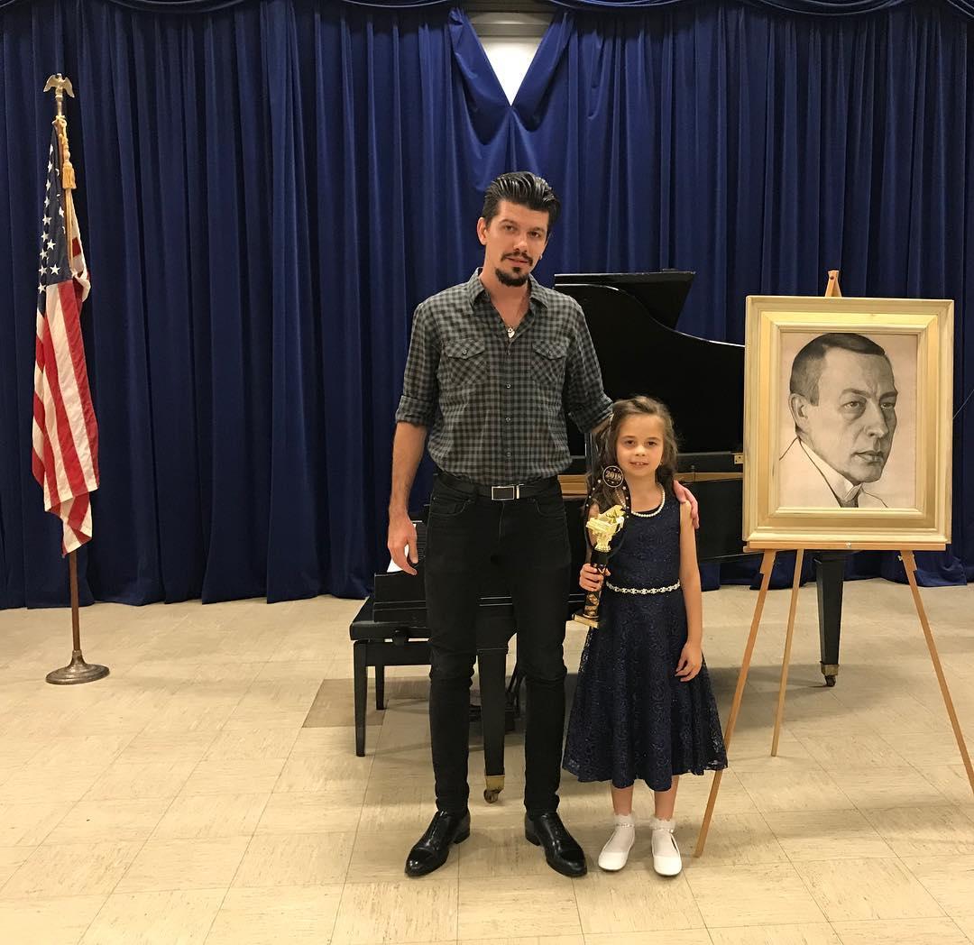 Aleksei Chebeliuk with a young accordion student
