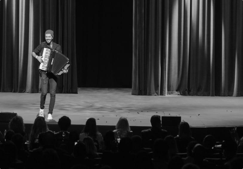 Aleksei Chebeliuk performing an enchanting accordion concert, showcasing his extraordinary musical talents and passion for the instrument.